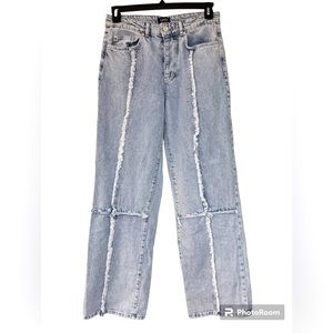 Ice blue distressed denim jeans.